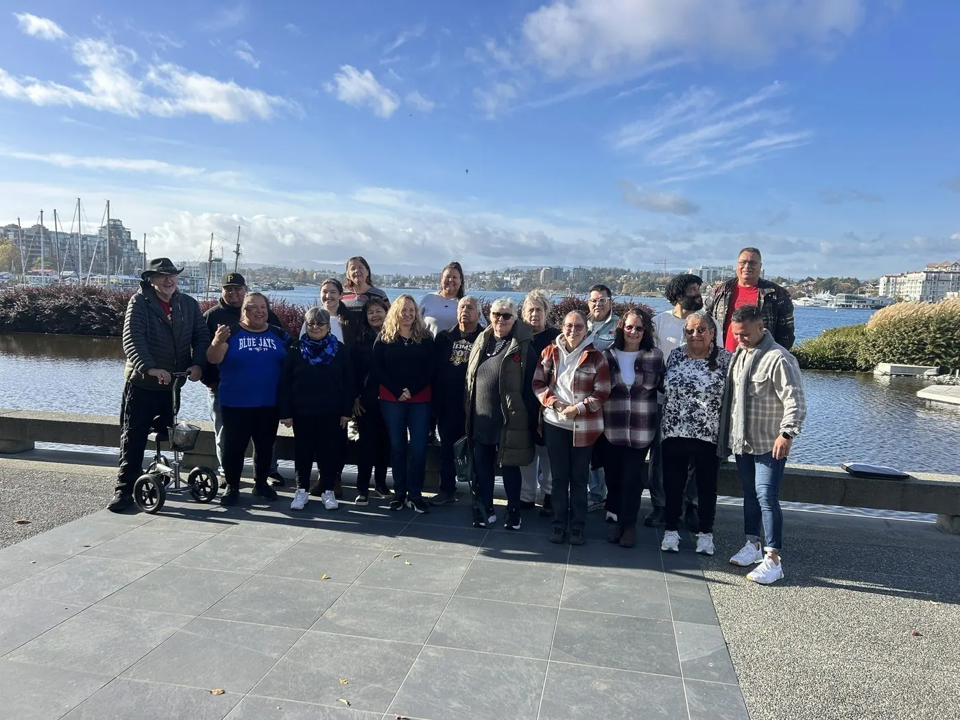 Eli Toombs with Train-the-Trainer partner community members on the waterfront in Canada